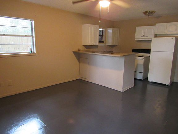 Living room area with view of breakfast bar