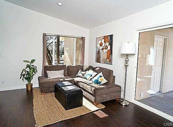 The family room area open to the kitchen with the sliding door t