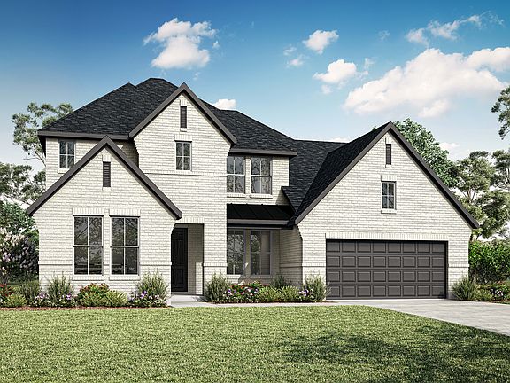 A two-story white house with a black roof, surrounded by lush greenery and a clear blue sky with flu