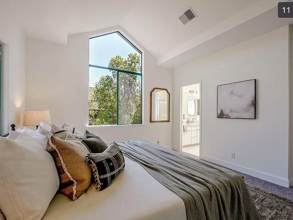 Master bedroom with vaulted ceiling
