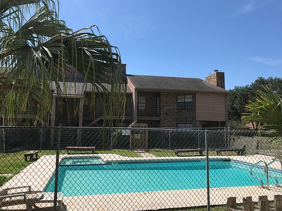 view of pool from condo fence