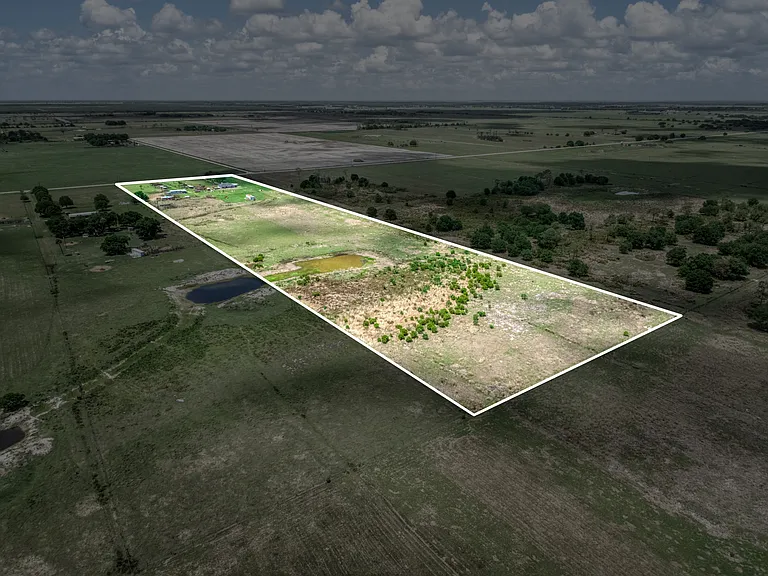 Aerial back view of the full lot