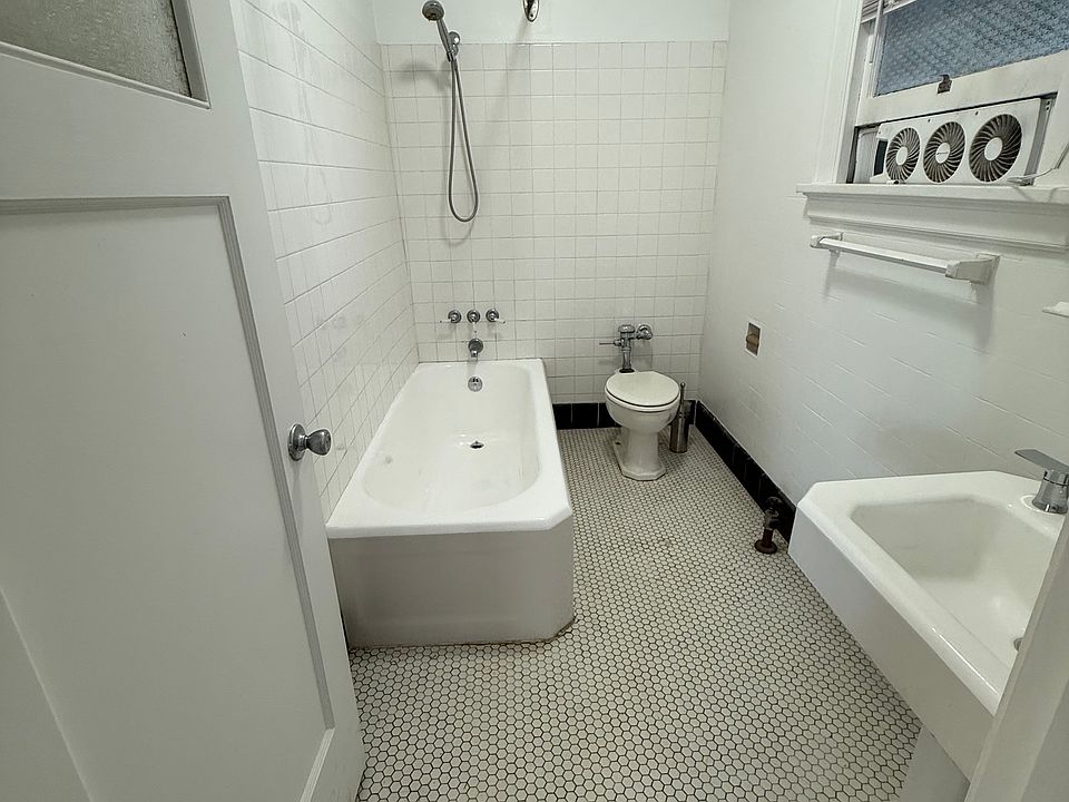 Bathroom with extra large antique tub