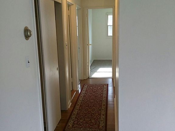 Hall to the bathroom and 3 bedrooms..