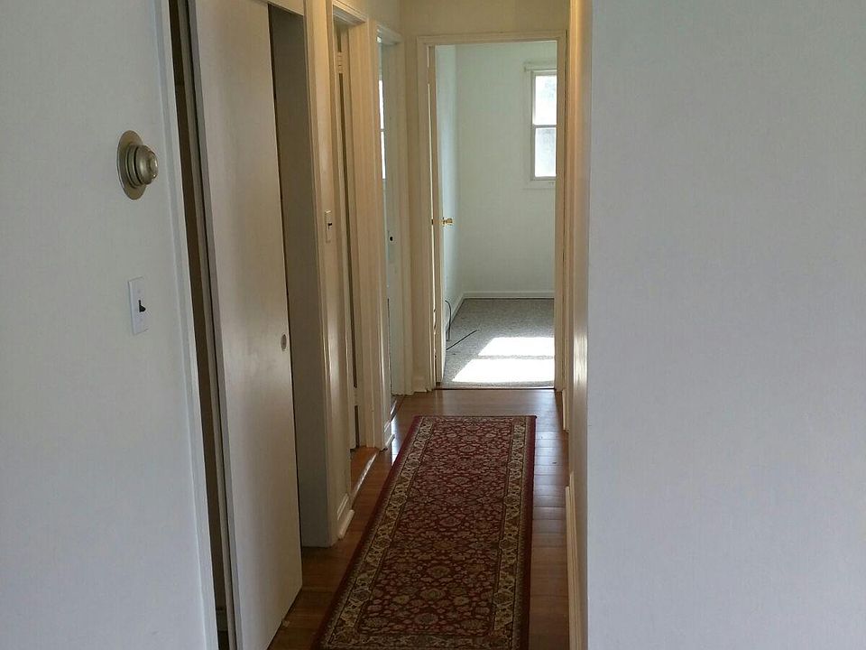 Hall to the bathroom and 3 bedrooms..
