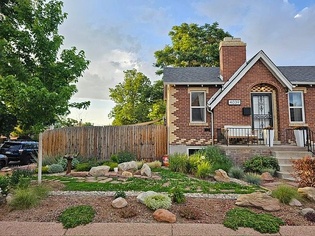 Front exterior and main entrance to home. Faces W 44th Ave.

Waterwise landscaping with TONS of perennials!
