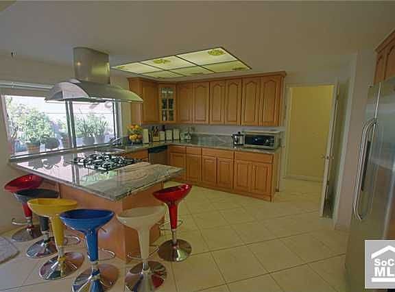 Kitchen w/ new maple cabinet, stainless steel appliances, and breakfast counte