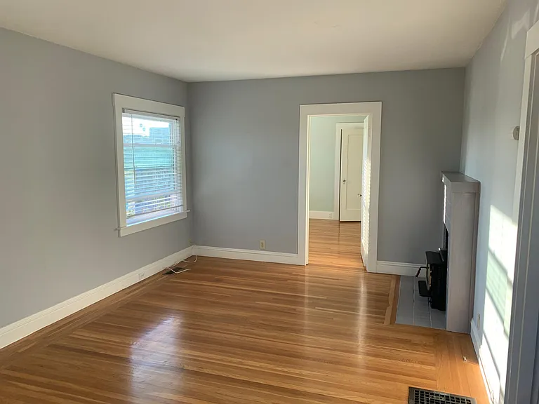 View from entrance -- living room area with bay windows