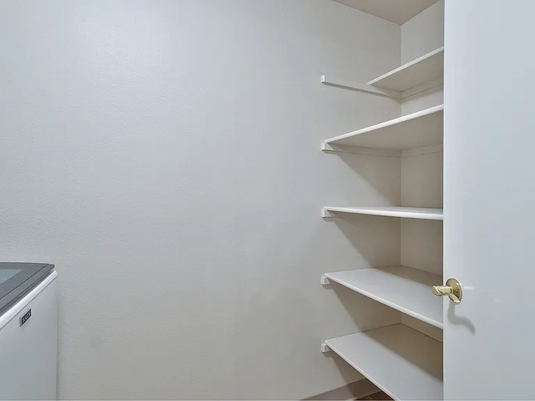 Lots of storage shelving in the laundry for extra supplies