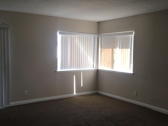 Spacious living room with sliding glass doors opening to patio