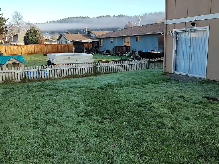 This grass area is off the kitchen and small patio. The grass is maintained during the growing season.