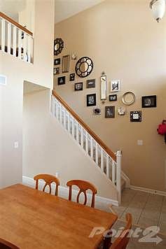 Large 2 story foyer entry with area for dining or could be used for an office .