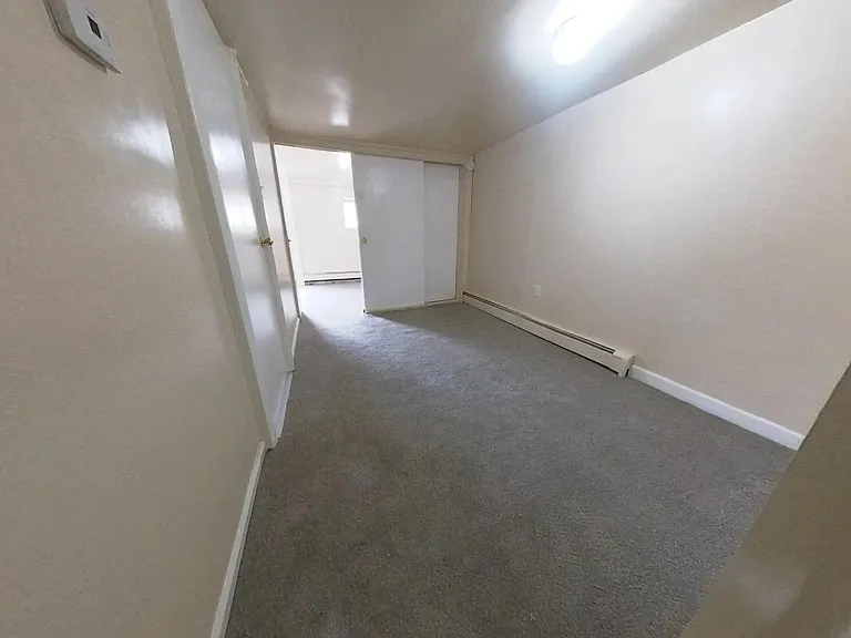 Bedroom - empty, facing lounge area