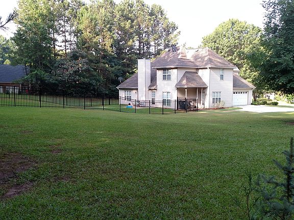 large yard.view of fence