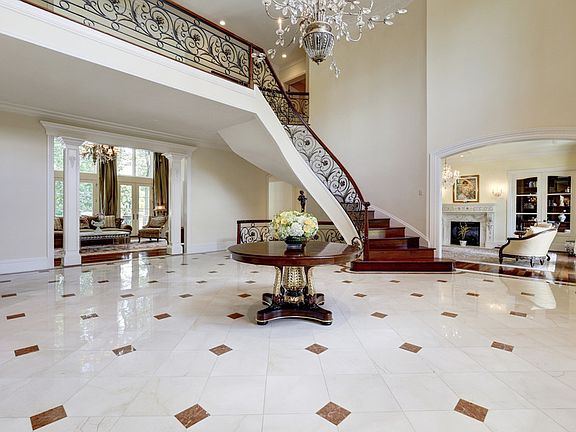 Two Story Foyer, Grand Floating Steps, Fine Arts Chandelier