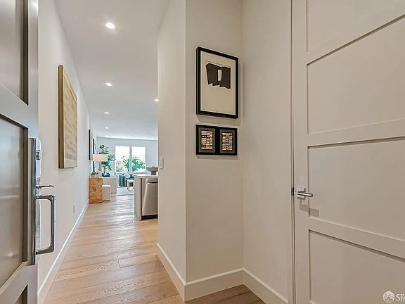 Unit Entrance, with 1/2 Bath & Laundry on Right