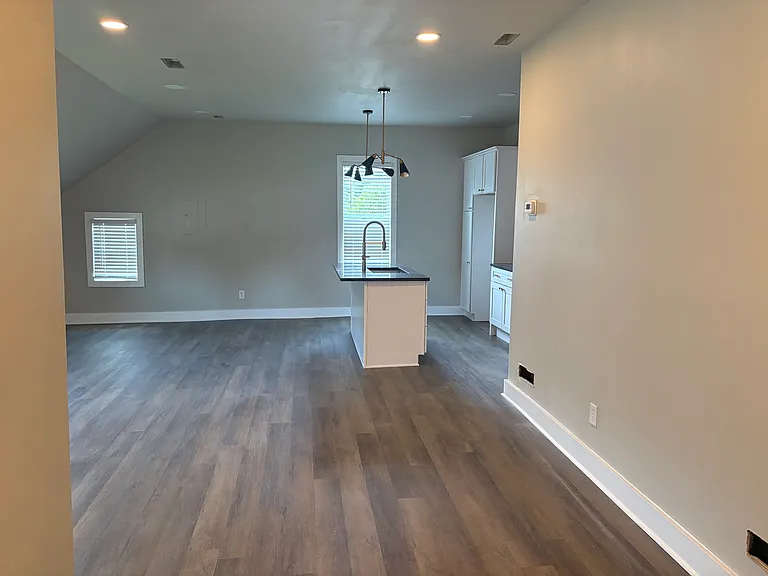 living room looking towards kitchen side view