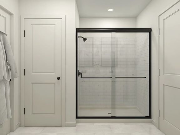 Primary bath with glass shower enclosure