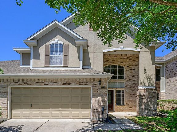 Beautiful curb appeal with high covered porch, stucco/brick exterior and oversized two car garage.