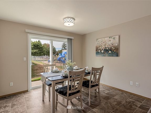 The gracious dining space, conveniently located just off the kitchen, is large in size.  Perfectly suited for casual dining, or big gatherings.