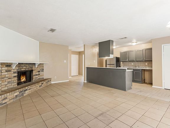 The spacious living room flows seamlessly into the kitchen, creating the perfect space for entertaining!