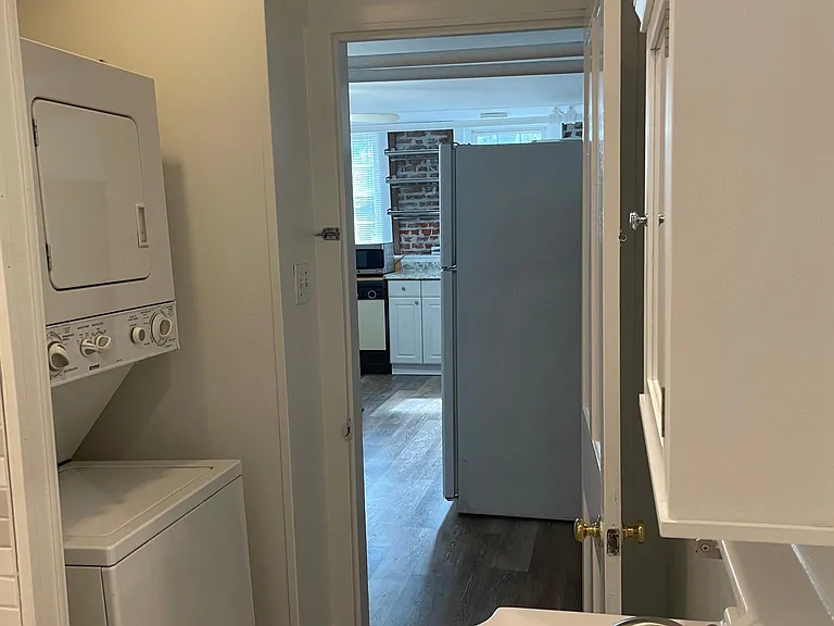 Bathroom with washer/dryer in unit.