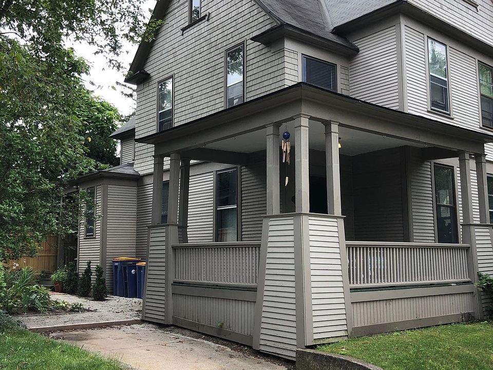 Side view with porch and drive.