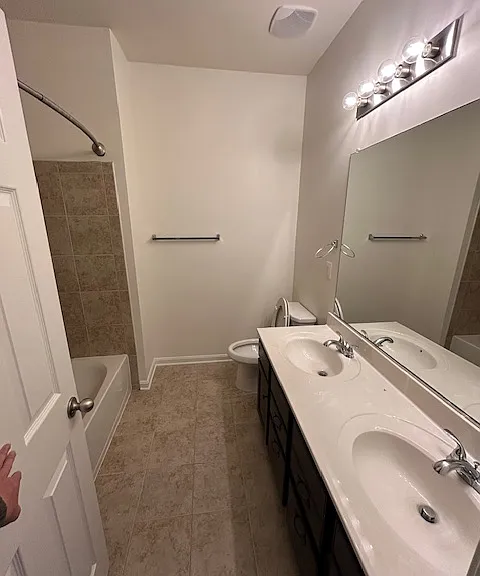 Upstairs bathroom with dual sinks for secondary bedrooms