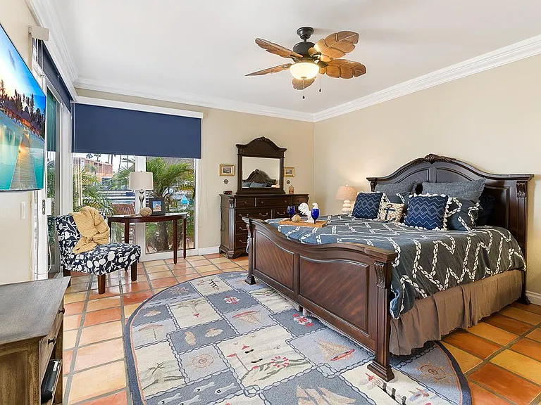 Master suite overlooking patio and channel.