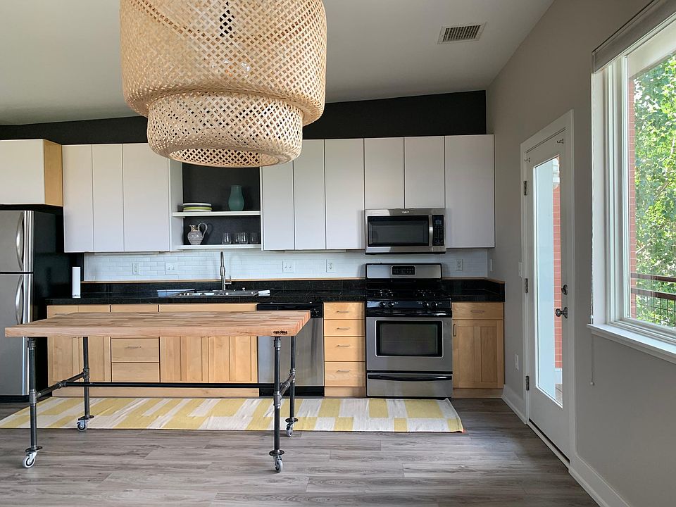 Updated kitchen with a movable island for multi functional living