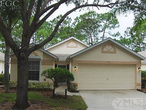 Front of house with 2 car garage.