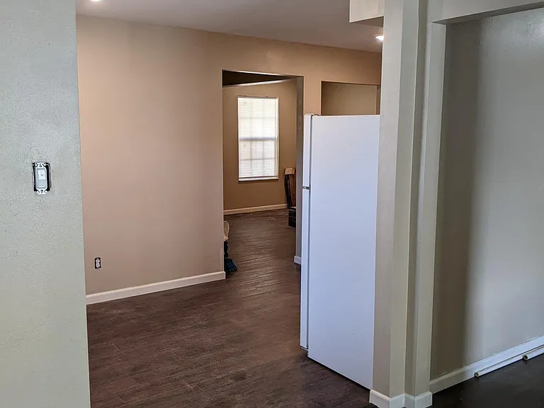 Looking from the living room, through the kitchen and into the second living room.