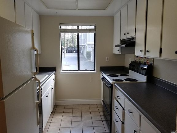 Kitchen light and bright with window.