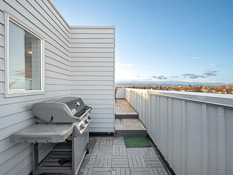 When you exit the house on the rooftop, this is just the beginning of the stunning views! Propane grill is ready to cook up all your favorite foods and just around the corner is a luxury hot tub, 70" TV, and toasty warm fire pit overlooking the lake!