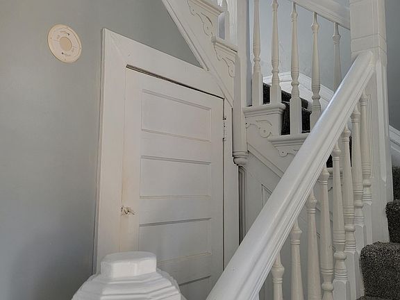 Staircase to 2nd floor, fresh paint, new carpet.