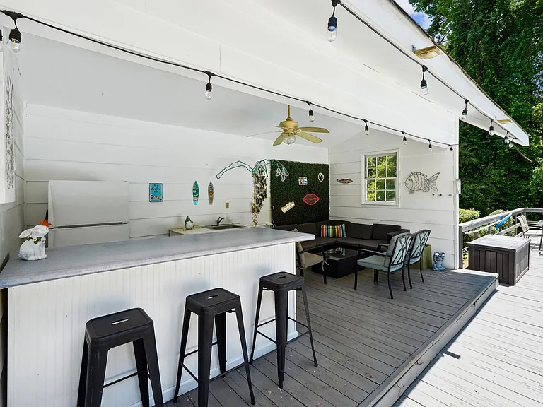 Pool house lounge with outdoor kitchen (sink only usable in summer pool season)
