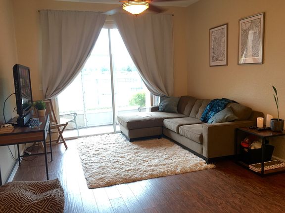 Living area over looking the lake with sliding glass doors t