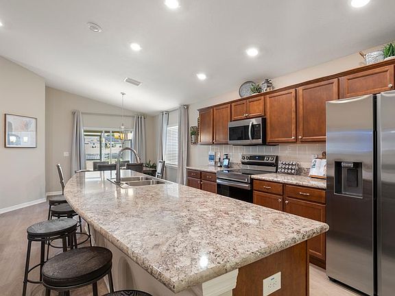 Your new kitchen includes birch wood cabinets, Samsung SS appliances, a walk-in pantry, and more.