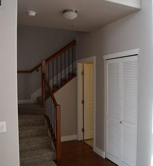 View from dining area toward laundry closet, guest bath, and