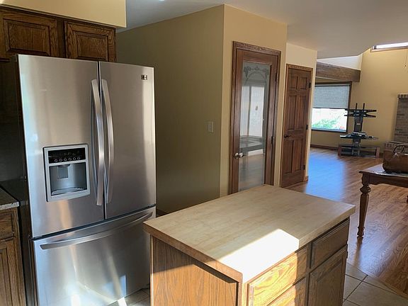 Kitchen with island; hardwood; large pantry; eat in kitchen area