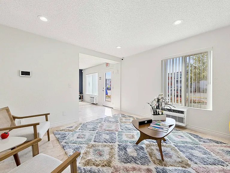 Experience the warmth and comfort of this sunlit modern living space.