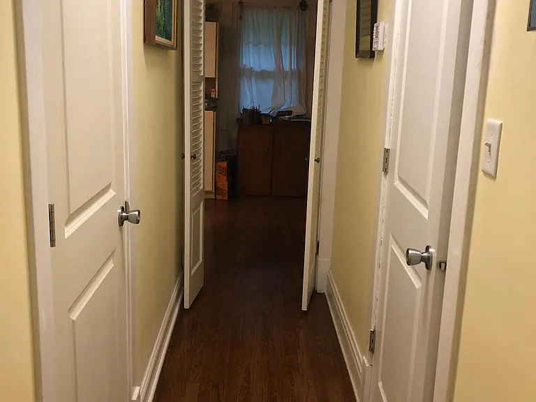 1st floor hallway, outside bathroom on right and coat closet on left