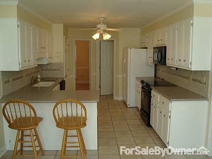 Custom Fiberglass Front Door
						:
						Wrought Iron Window Accents