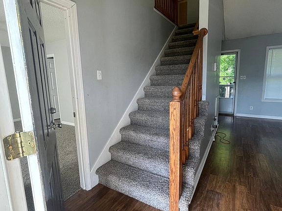 Front stairway with Primary Bedroom to the left.
