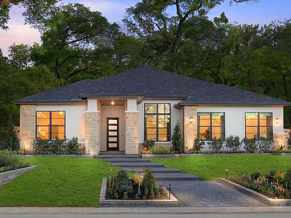 custom home with stone and stucco exterior