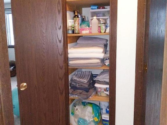 Super deep linen closet with storage for sheets/towels and all of your hair/makeup products & more!