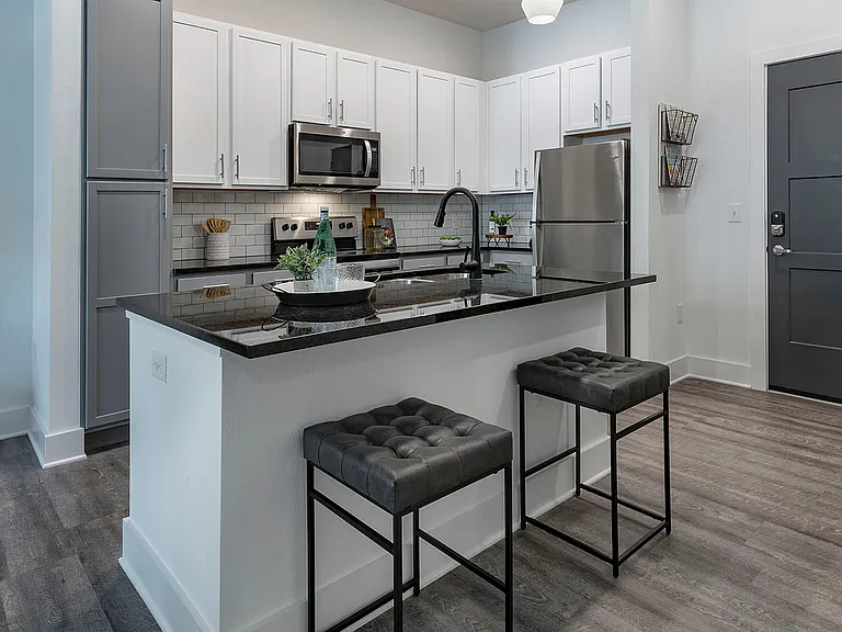 Step into elegance with this contemporary kitchen that blends functionality and style.