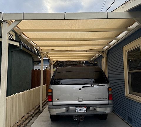 Covered driveway, room for 2-3 cars.