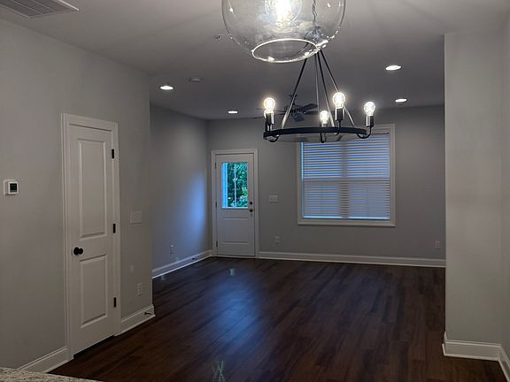 Open Floor Plan Living Area. View from Kitchen. Room for table and large couch and TV for entertaining