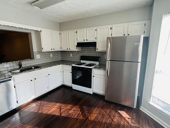 Stainless steel Appliance and Breakfast nook with bay window